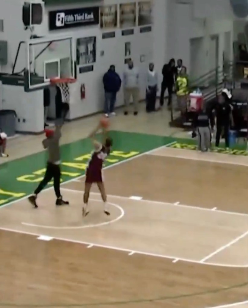 A fan tried to stop this layup attempt in a bizarre moment.